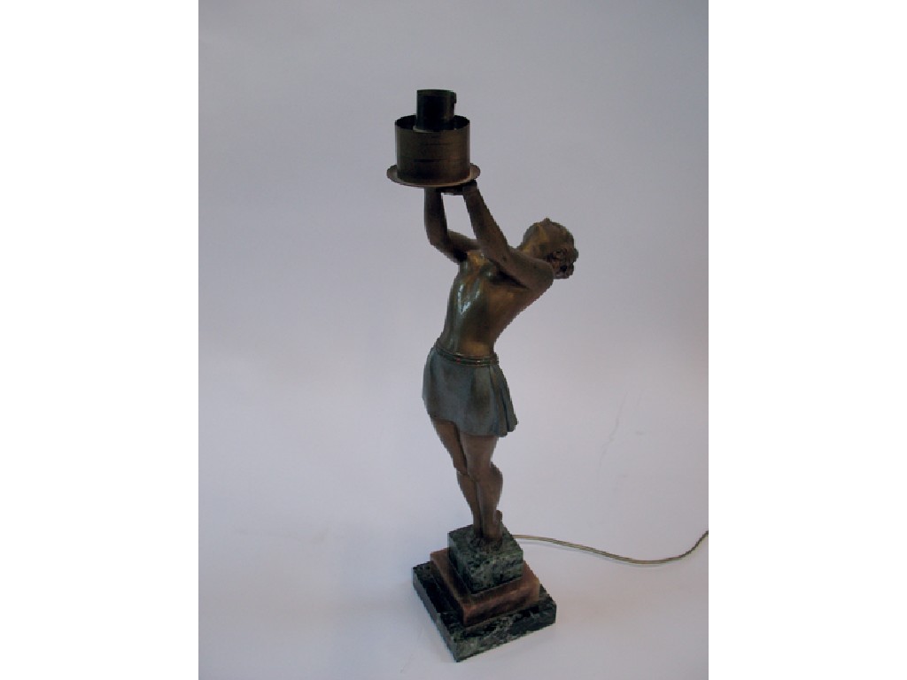 Appraisal: AN ART DECO PATINATED AND GILT SCULPTURE of a semi-naked