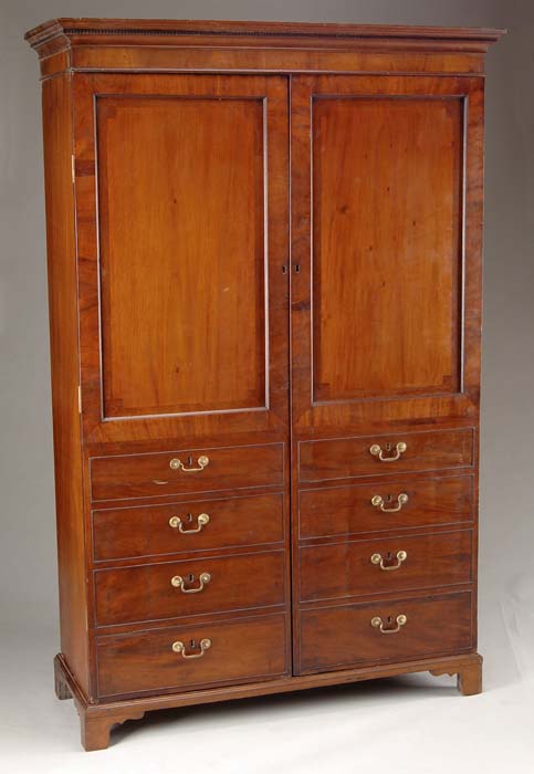 Appraisal: CHIPPENDALE GEORGE III PERIOD MAHOGANY CARVED WARDROBE Three part wardrobe