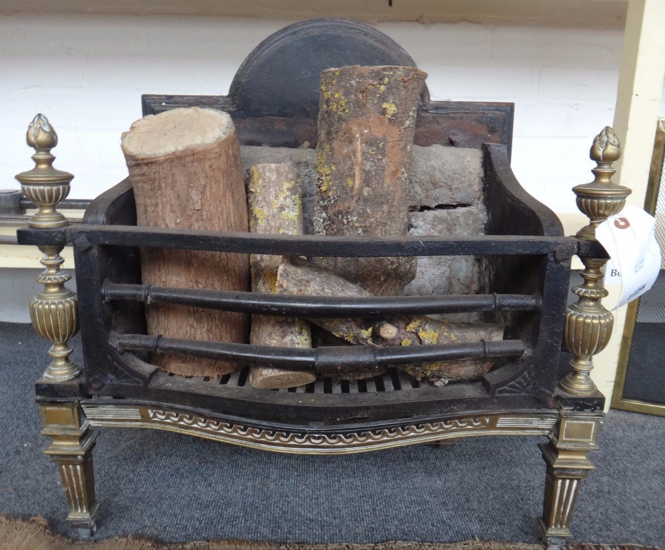 Appraisal: A late Victorian cast iron fire basket circa with brass