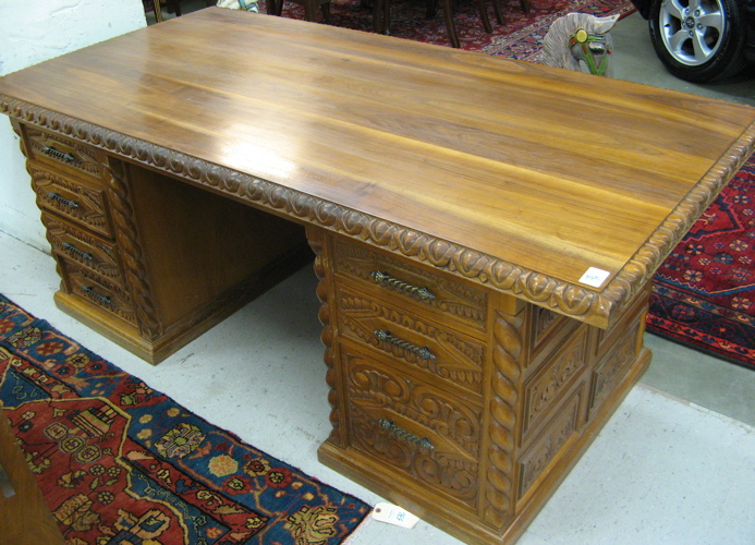 Appraisal: CARVED FLAT-TOP EXECUTIVE DESK th century having a large rectangular