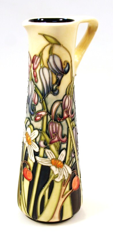 Appraisal: A Moorcroft Wild Meadow pattern jug of tapering cylindrical form