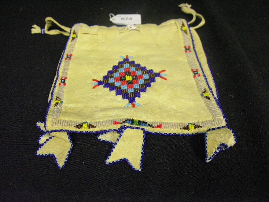 Appraisal: NATIVE AMERICAN BEADED BAG Drawstring bag with side panel Beaded