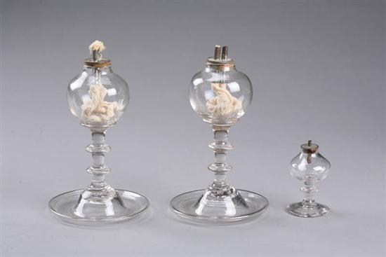 Appraisal: THREE OIL LAMPS American early th century blown glass Pair