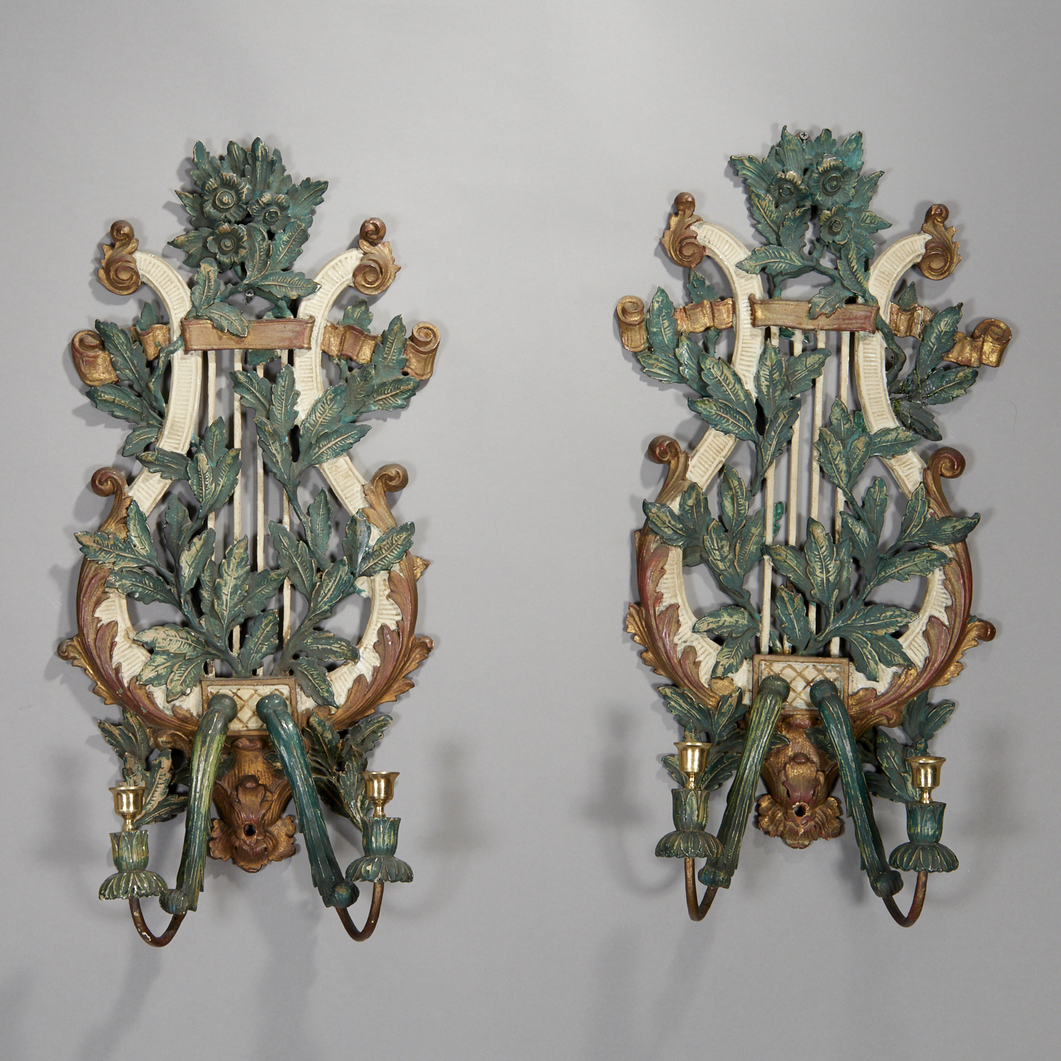 Appraisal: PAIR ITALIAN GILT AND POLYCHROMED WOOD SCONCES th th c