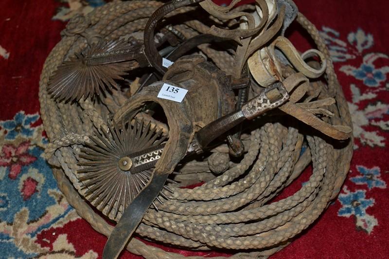 Appraisal: TWO LEATHER LEADS A PAIR OF SPURS AND A NUSSEL