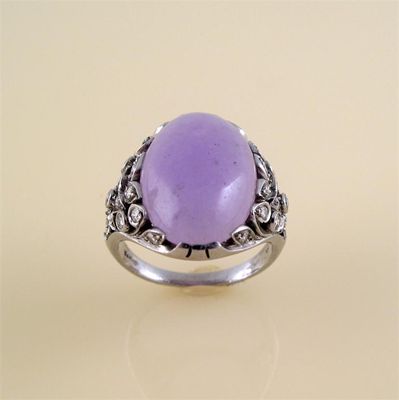 Appraisal: A lavender jade and diamond ring the oval jade cabachon