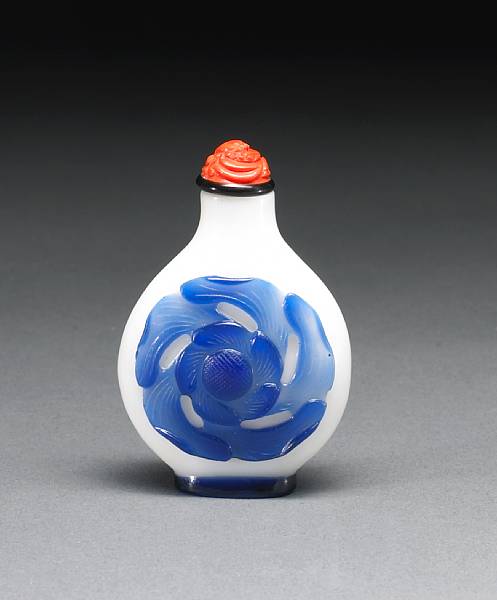 Appraisal: A good blue overlay decorated white glass snuff bottle -