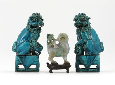 Appraisal: A pair of Chinese turquoise-glazed Buddhistic lion dogs and another