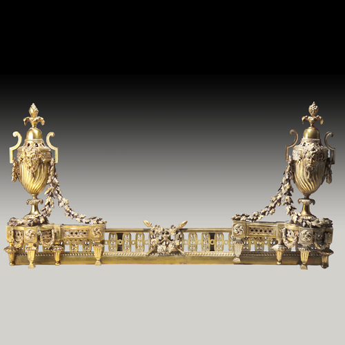 Appraisal: French gilt bronze fireplace fender with urn and garland motif