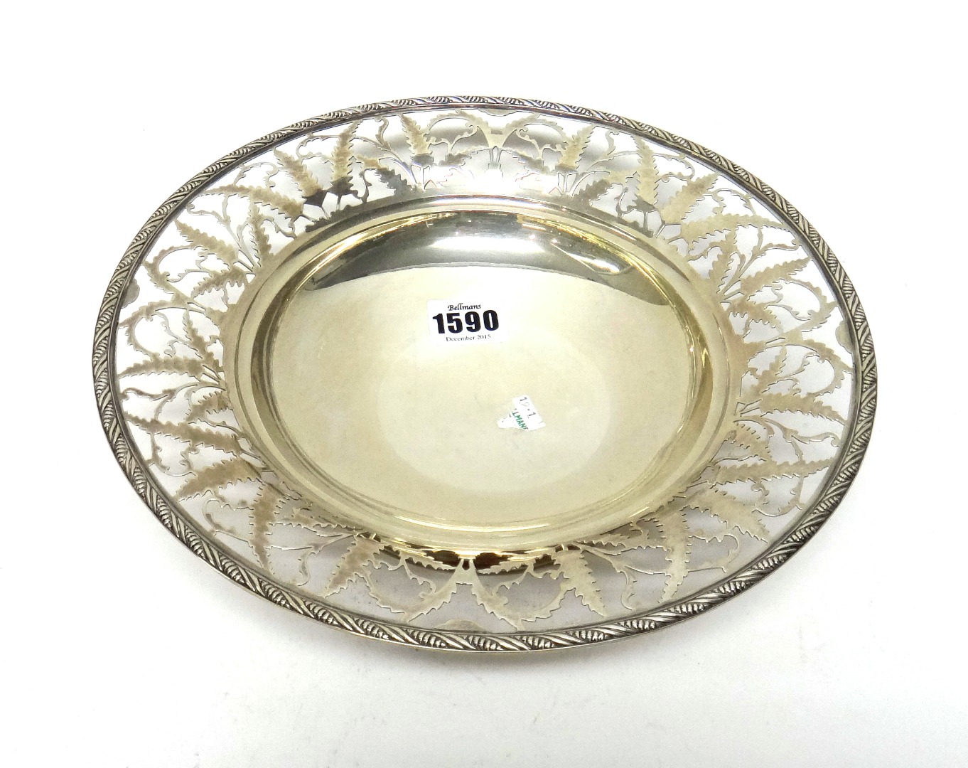 Appraisal: A silver dish of circular form decorated with a fern