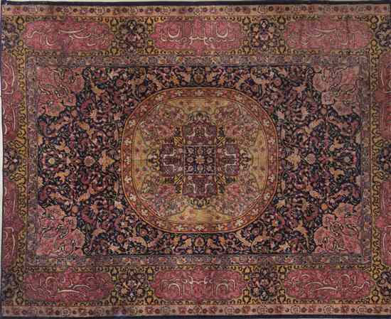 Appraisal: A Persian Wool Rug centered with a foliate medallion on