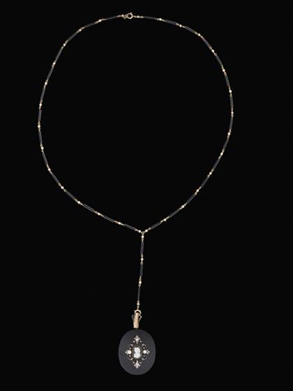 Appraisal: Onyx pendant and neck chain Victorian mourning pendant of black