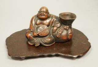 Appraisal: Asian Ceramic Figure Seated with Fan and Sack Co Asian