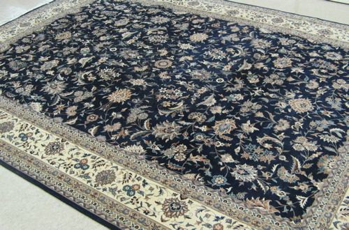 Appraisal: HAND KNOTTED PAKISTANI-PERSIAN CARPET Isfahan design overall scrolling floral raceme