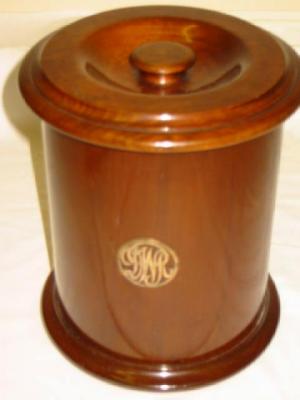 Appraisal: A WALNUT DUNHILL TOBACCO BOX of cylindrical form zinc lined