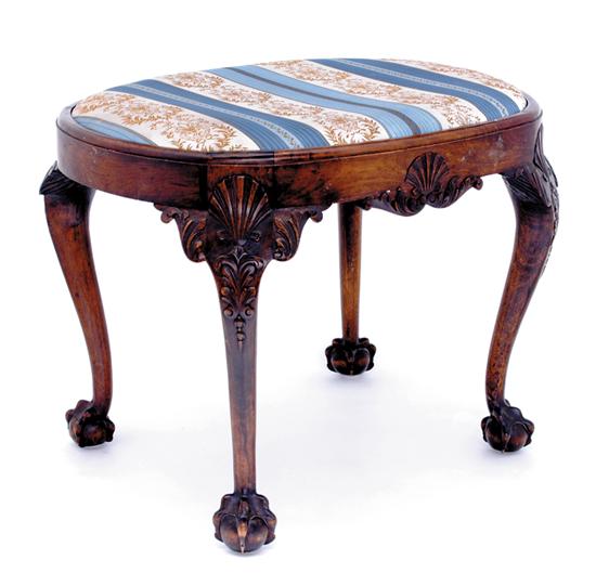 Appraisal: Chippendale style walnut stool oval upholstered slip seat retained by