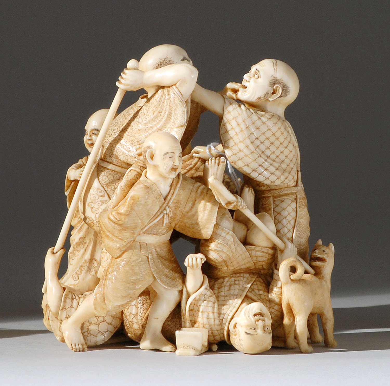 Appraisal: IVORY FIGURE GROUP Meiji PeriodBy Mitsuchika Depicting seven blind men