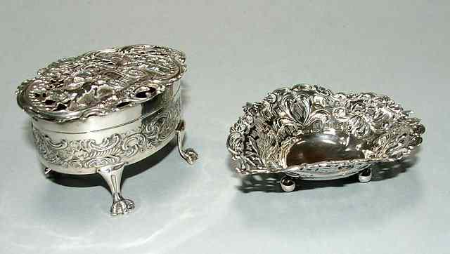 Appraisal: A SILVER POMANDER bow fronted standing on claw feet pierced