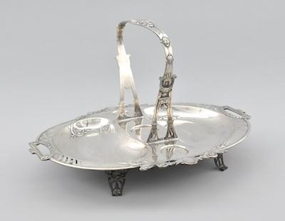 Appraisal: An Austro-Hungarian Silver Basket Centerpiece With depressions for holding glass