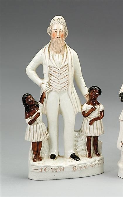 Appraisal: Staffordshire polychromed figural group of John Brown and two children