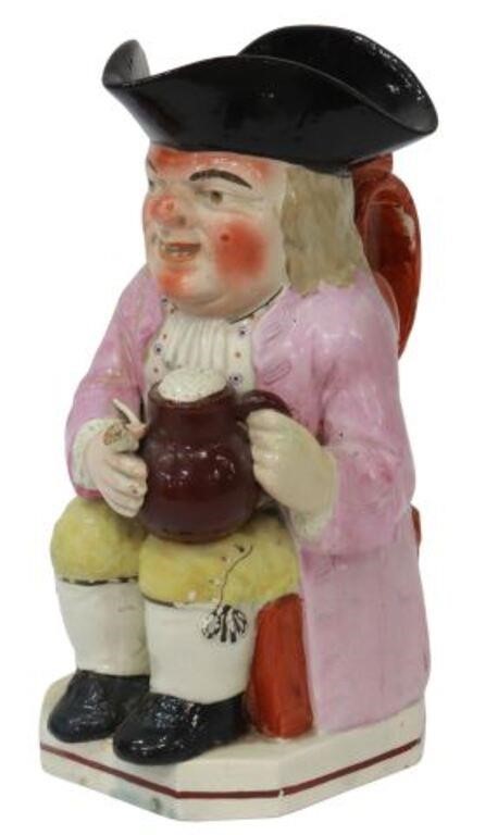 Appraisal: English Staffordshire Toby jug th c seated man wearing a