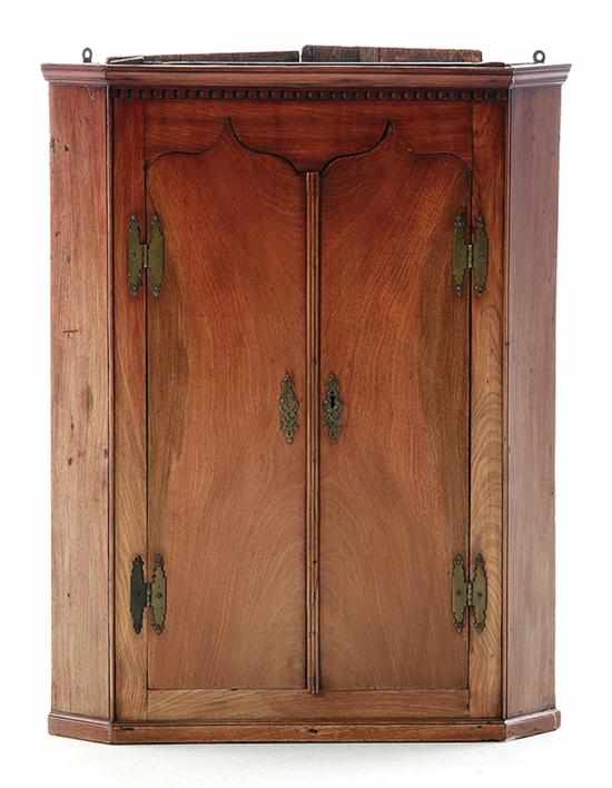 Appraisal: Regency style mahogany hanging corner cabinet late th century dentil-molded