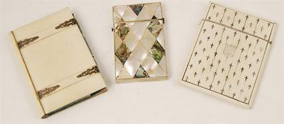 Appraisal: A Victorian ivory card case inlaid abalone crosses the front