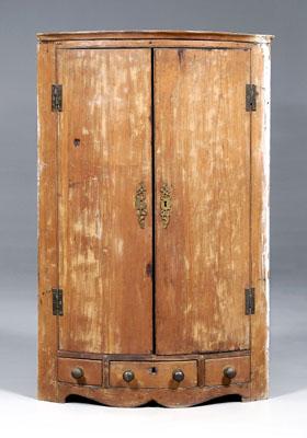 Appraisal: Continental hanging corner cupboard two bow-front doors opening to three