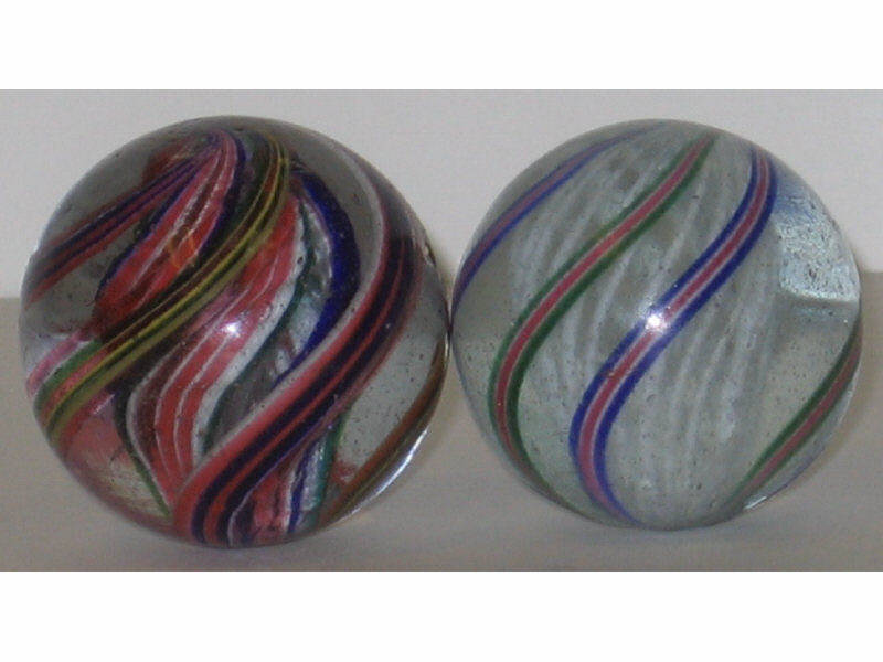 Appraisal: TWO LARGE LATTICINIO SWIRL MARBLES White open core with six