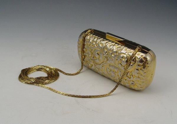 Appraisal: JUDITH LEIBER EMBOSSED METAL PURSE As a clutch or with