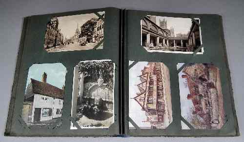 Appraisal: An early th Century postcard album containing a selection of