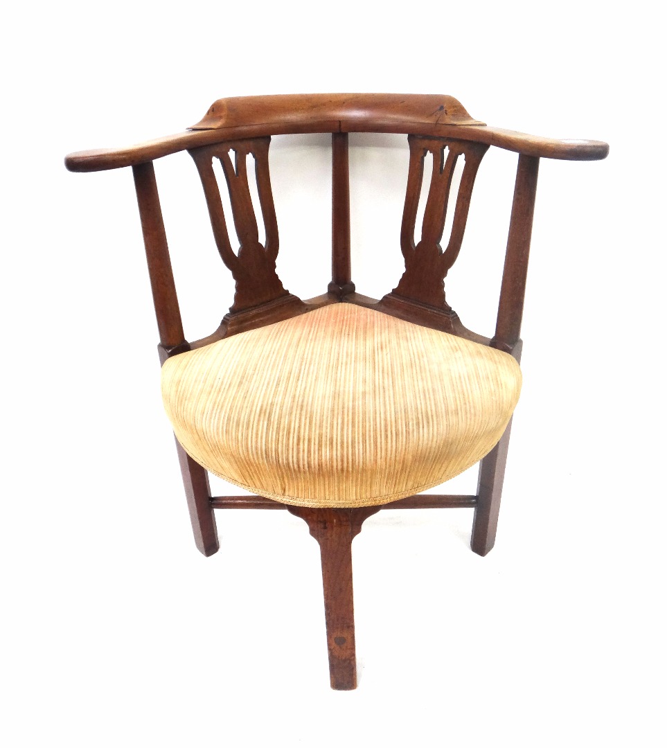 Appraisal: A George III mahogany corner writing chair with curved back