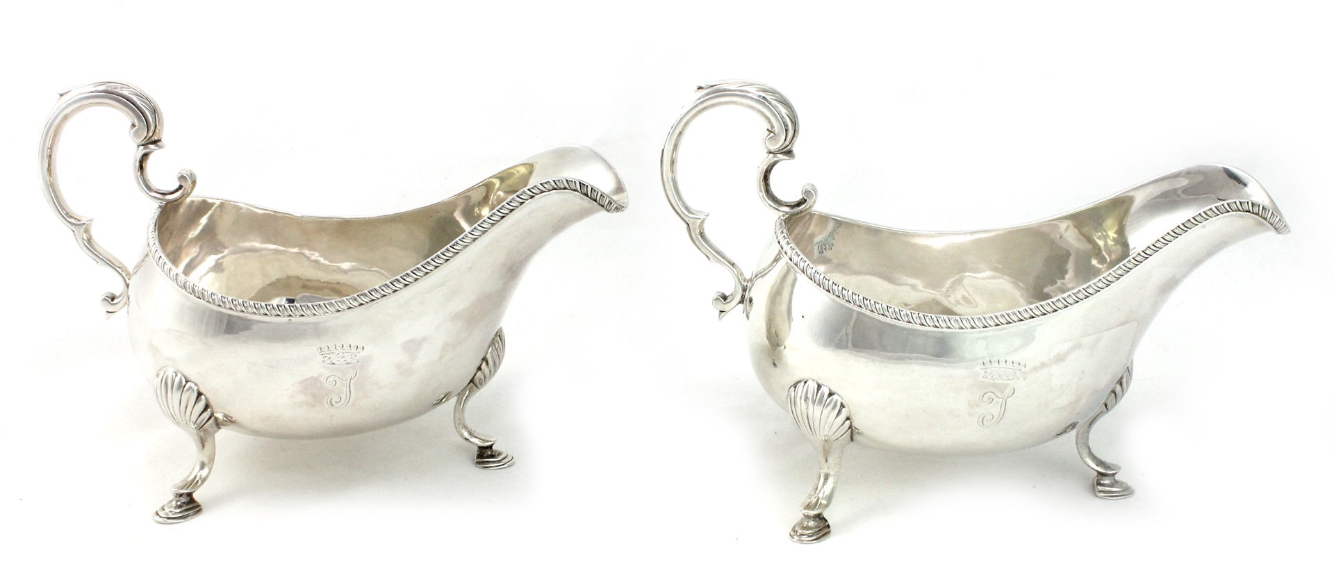 Appraisal: A pair of George III Irish silver sauceboats each with