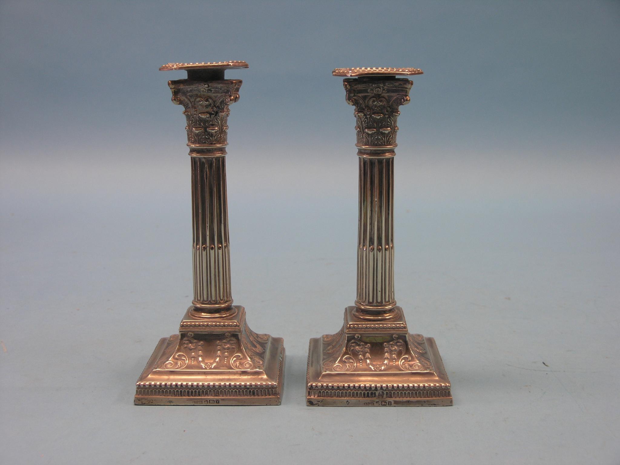 Appraisal: A pair of late Victorian silver candlesticks corinthian columns with