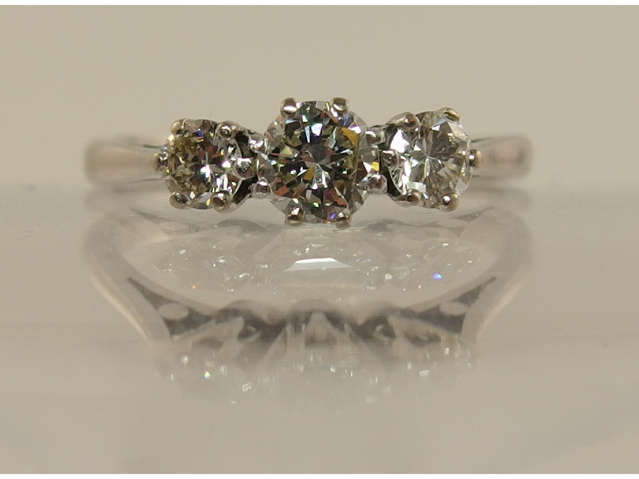 Appraisal: A platinum three stone diamond ring of approx cts combined