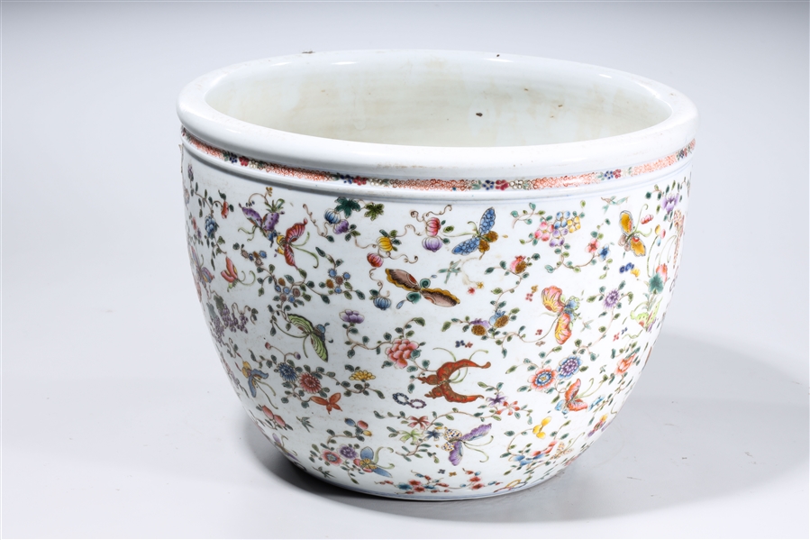 Appraisal: Chinese enameled porcelain jardiniere with flower and butterfly decoration concentric