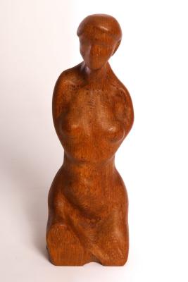 Appraisal: A carved wooden figure of a nude woman cm high