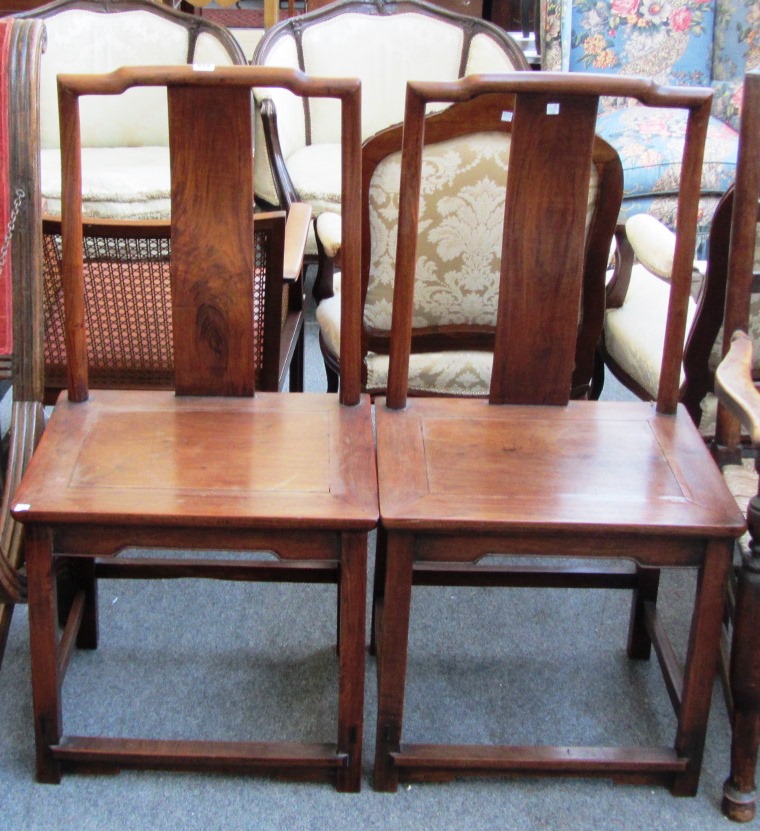 Appraisal: A pair of th century Chinese hardwood chairs with solid