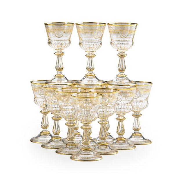 Appraisal: MOSER STYLE WINE GLASSES Set of thirteen gilt decorated cut