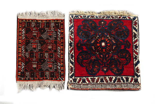 Appraisal: AN OLD MIDDLE EASTERN RED AND BLUE GROUND RUG with