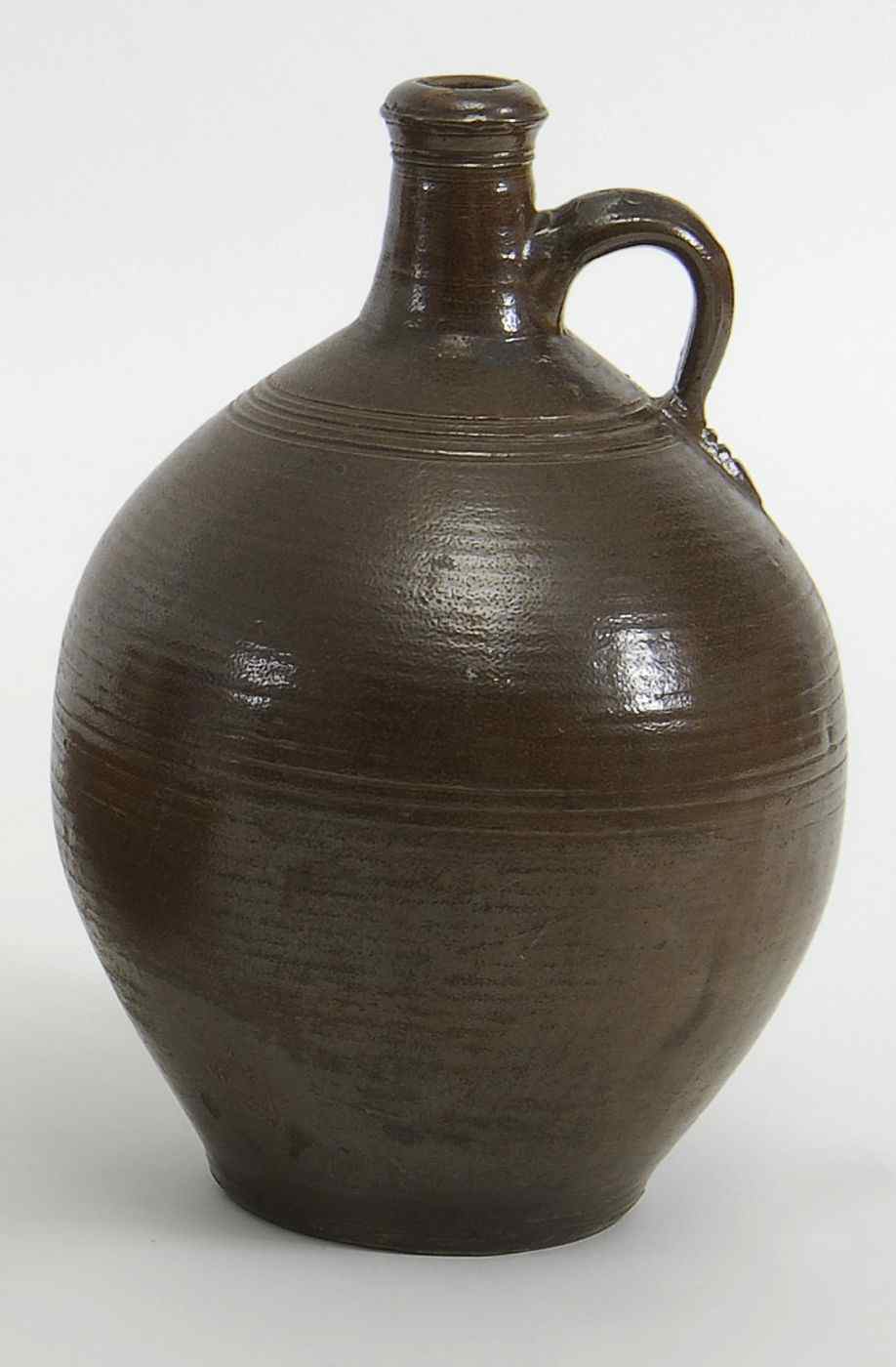 Appraisal: ANTIQUE GERMAN OVOID BROWN-GLAZED STONEWARE JUG th CenturyHeight Provenance From