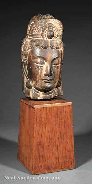 Appraisal: A Chinese Carved Stone Head of Guanyin variegated brown stone