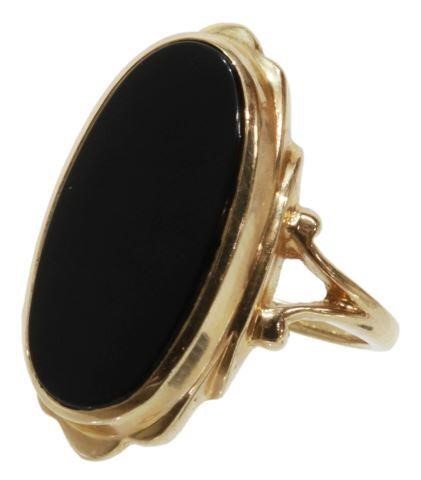 Appraisal: Estate kt yellow gold ring set with an oval cabochon