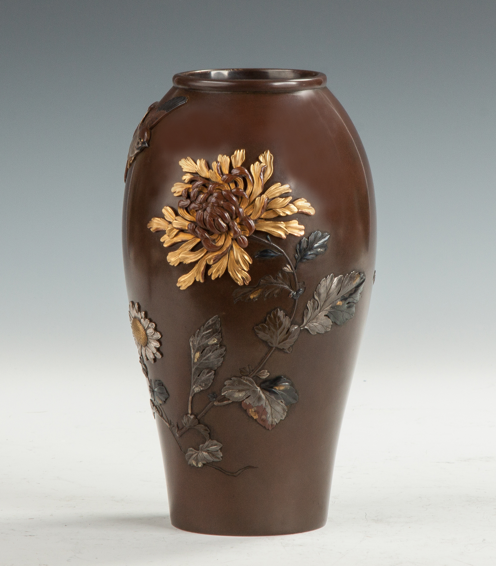 Appraisal: Japanese Mixed Metal Vase Meiji period With florals leaf bird