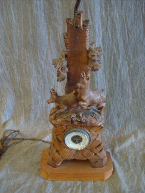 Appraisal: Black Forest carved wood barometer as lamp Property from Chappaqua