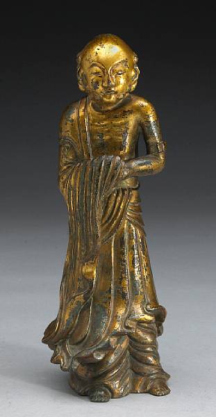 Appraisal: A gilt bronze figure of a luohan Hollow cast in