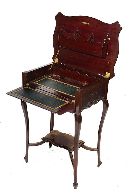 Appraisal: AN EARLY TH CENTURY MAHOGANY WRITING TABLE the serpentine top