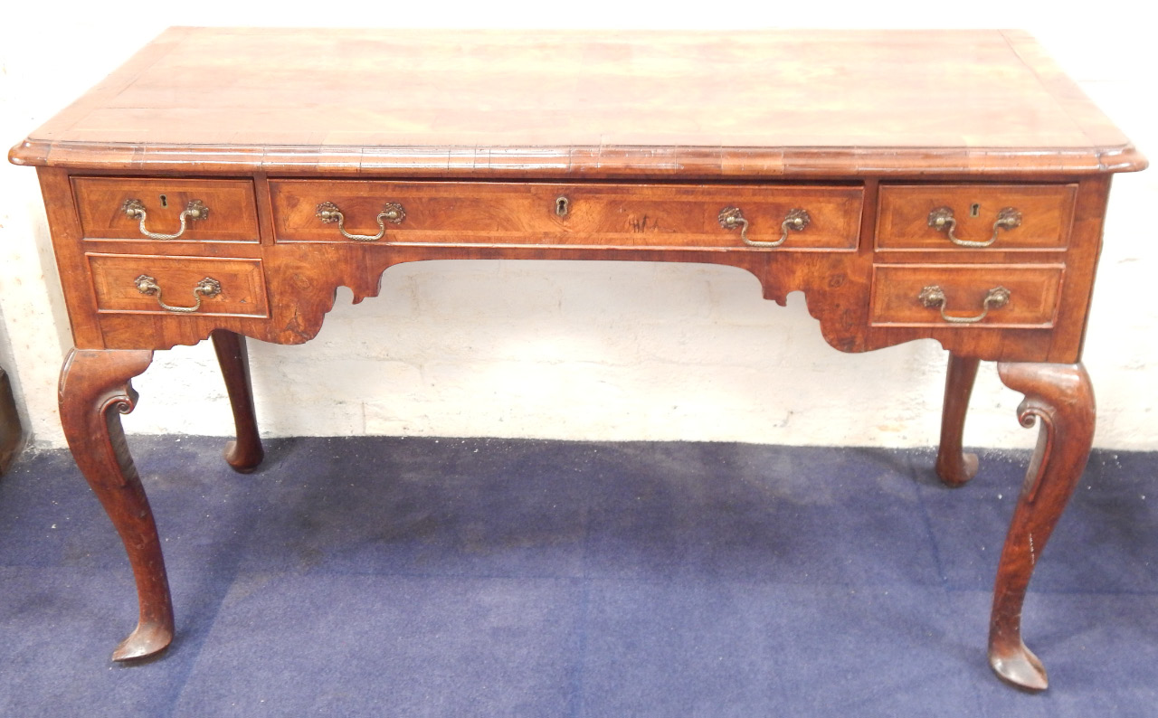 Appraisal: An thC and later walnut lowboy with a quarter veneered