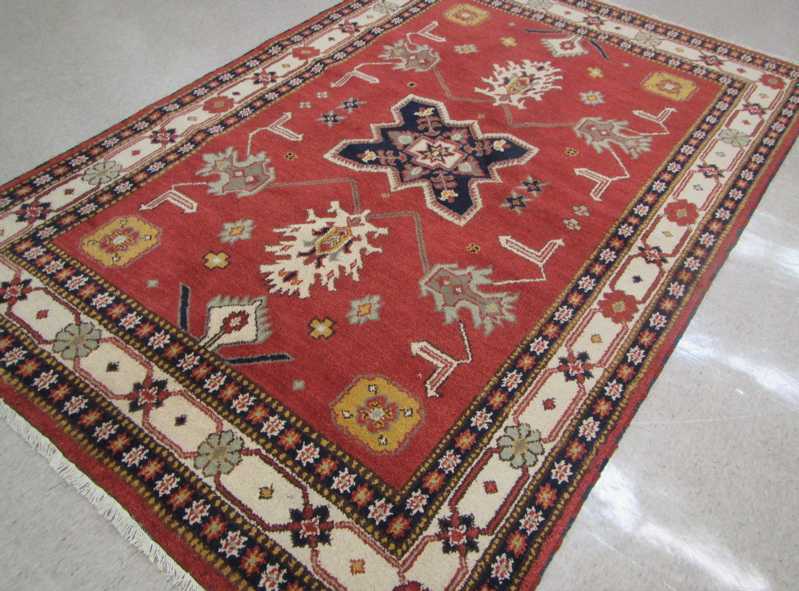 Appraisal: HAND KNOTTED ORIENTAL CARPET Indo-Persian stylized floral and central medallion