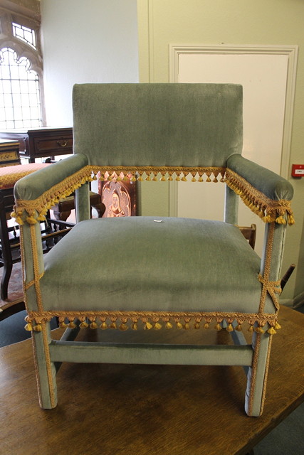 Appraisal: A PAIR OF ITALIANATE GREEN VELVET UPHOLSTERED HALL CHAIRS